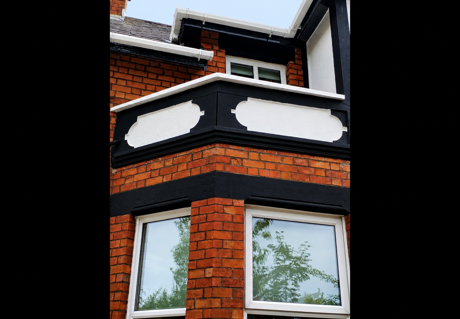 Completed exterior restoration Bangor — repainted decorative rendered bay and cornice, front elevation