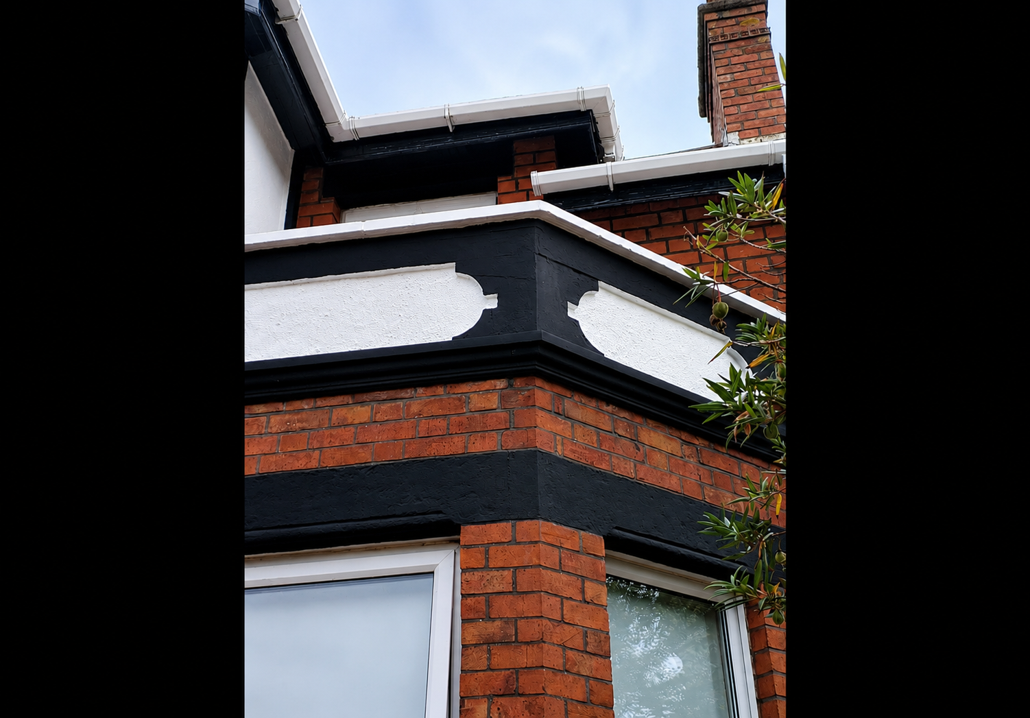 Completed exterior restoration Bangor — repainted decorative render and timberwork, side elevation detail