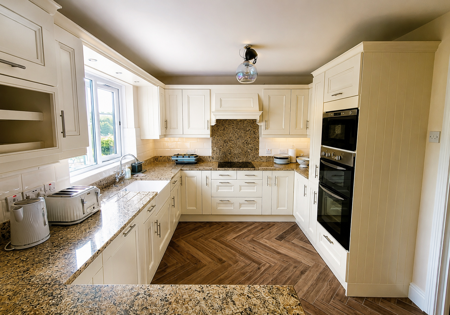 Hand painted kitchen units in a light cream finish